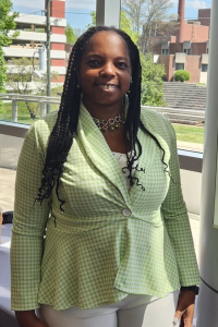 Image of Dr. Freneka Minter standing by a window in the Cal Turner Family Center at Meharry Medical College