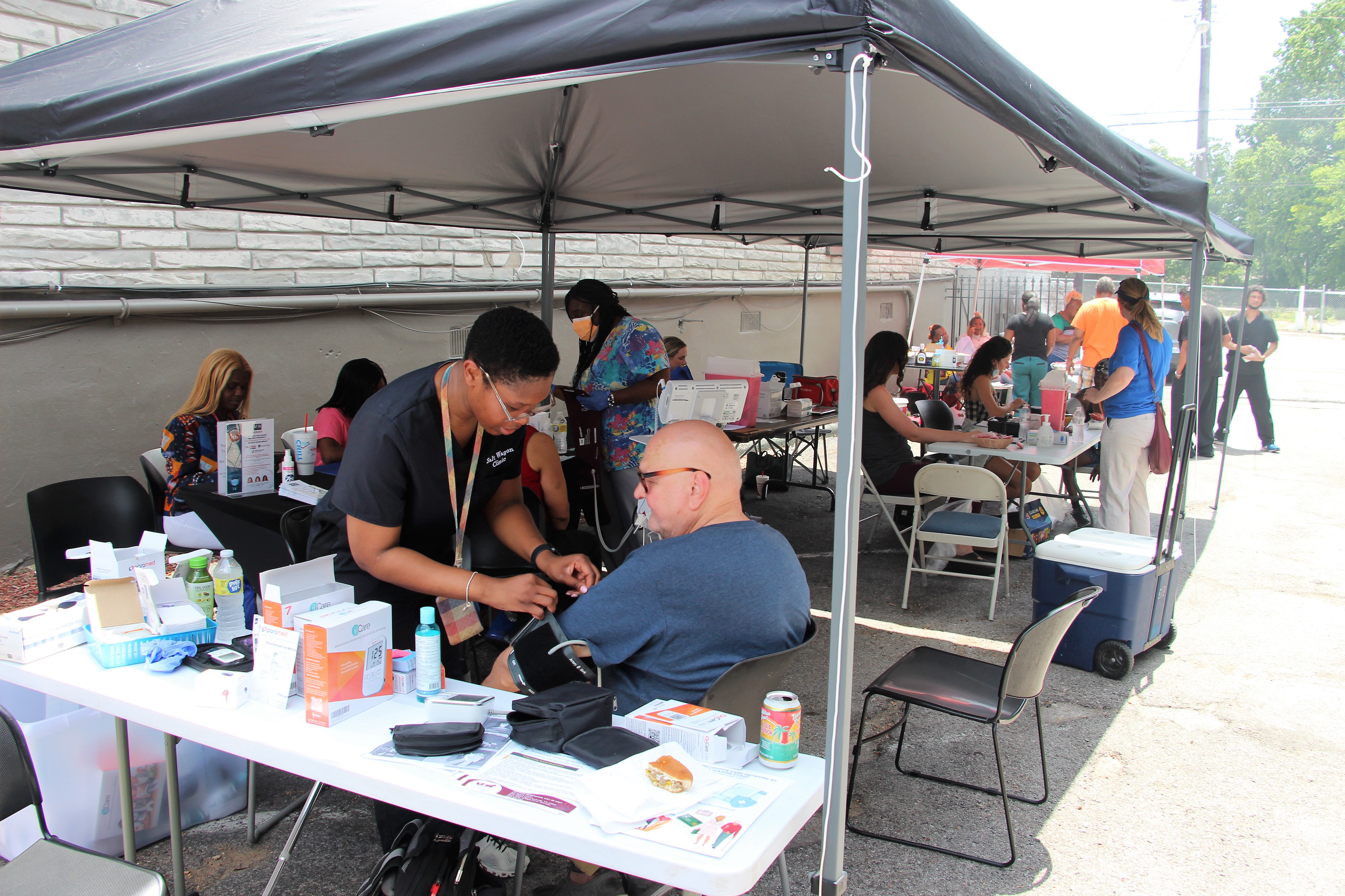 Health screening under a canopy tent